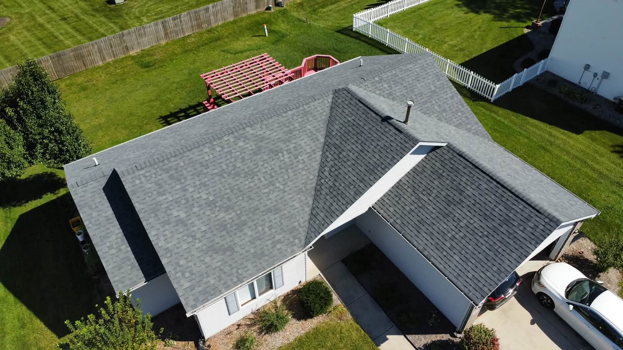 Aerial view of a home with a newly installed Owens Corning Oakridge Estate Gray shingle roof by Affordable Roofing